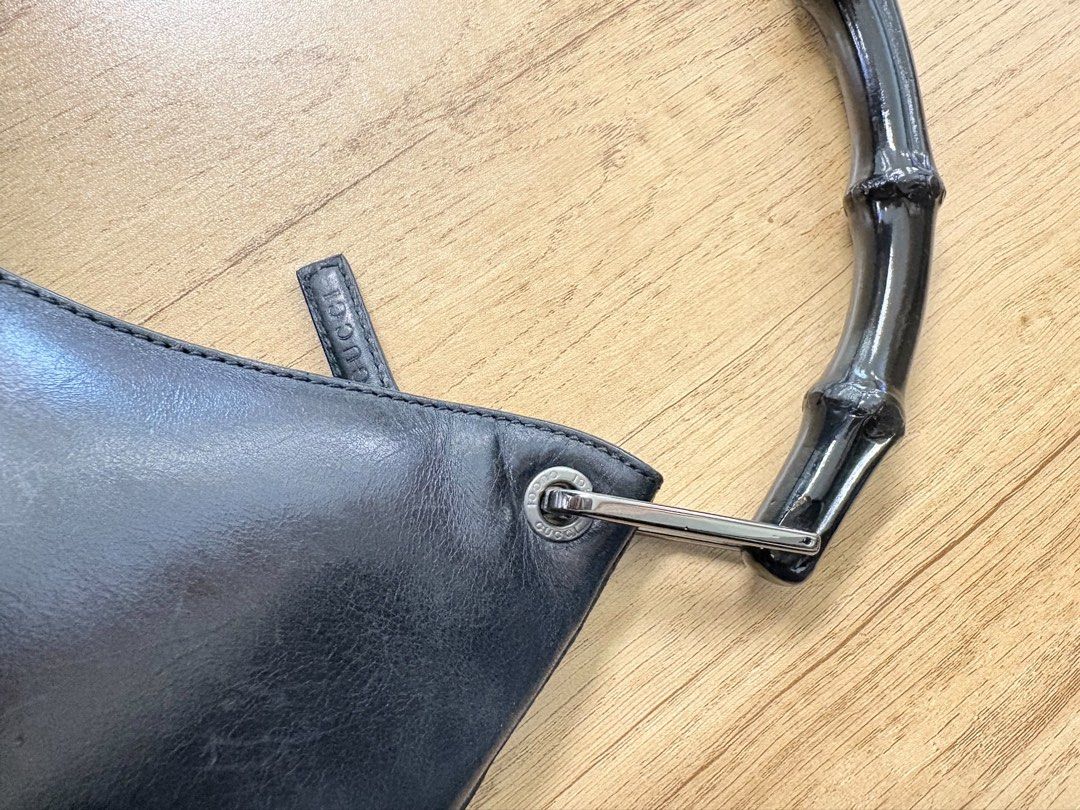Gucci Black Leather Bamboo Handle Bag (Category: Luxury Bags & Wallets) located in Manila. Submitted by thriftpoint99 (Listing ID 1443671889, Image 3). Description: Issue cut tag need to replace and scratch sign of usage Good condition.