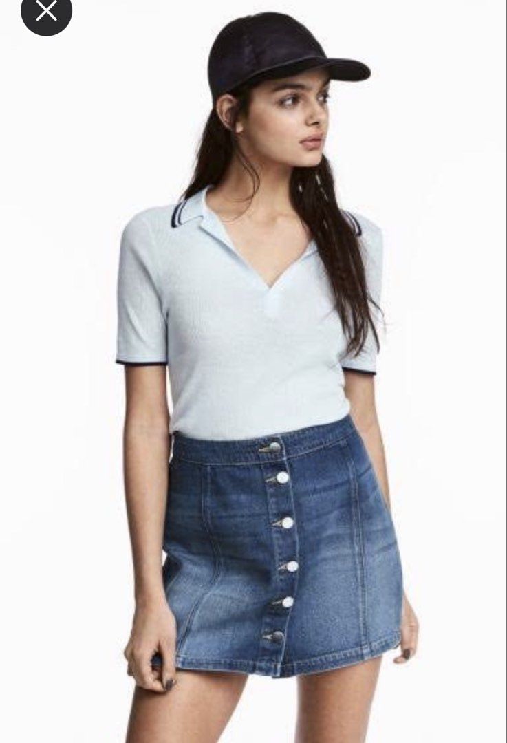 H&M Divided Ribbed Polo Shirt (Category: Shirts) located in Pasig City. Submitted by declutter_dpc (Listing ID 1443611767, Image 1). Description: - White ribbed polo shirt from H&M Divided - Short sleeves with navy trim - Collar also features navy trim - Ideal for casual wear.