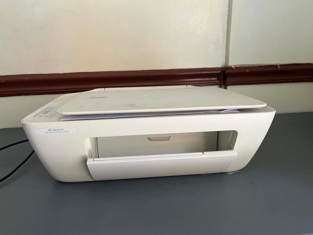 HP DeskJet All-in-One Printer (Category: Printers, Scanners & Copiers) located in Quezon City. Submitted by iam3871 (Listing ID 1443546179, Image 2). Description: - HP DeskJet All-in-One Printer - Functions: Print, Scan, Copy - Color: White - Condition: Works perfectly - Includes: Power cable - Note: Minor ink stains on the top cover.