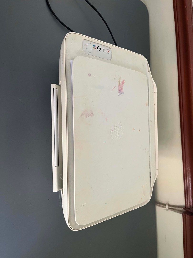 HP DeskJet All-in-One Printer (Category: Printers, Scanners & Copiers) located in Quezon City. Submitted by iam3871 (Listing ID 1443546179, Image 1). Description: - HP DeskJet All-in-One Printer - Functions: Print, Scan, Copy - Color: White - Condition: Works perfectly - Includes: Power cable - Note: Minor ink stains on the top cover.