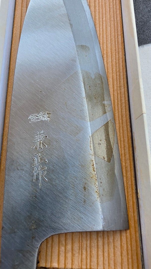 Japanese Kitchen Knife with Box (Category: Knives & Chopping Boards) located in Naga. Submitted by solamia (Listing ID 1443500236, Image 2). Description: - Authentic Japanese knife - Comes with original box - Blade has minor signs of use and discoloration - Excellent addition to any kitchen.