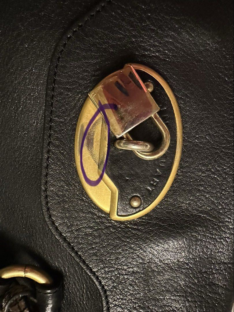 Jill Stuart genuine leather bag (Category: Luxury Bags & Wallets) located in Paranaque City. Submitted by love1927 (Listing ID 1443580150, Image 3). Description: UP for grabs is my lightly used JILL STUART - Classic black leather satchel bag IN Genuine Calf leather -flaws: kindly check the photo on the lock - Versatile: Two way and detachable crossbody strap - Elegant gold hardware - Adorable snake print detail tag Size: Length:12 inches Height:1