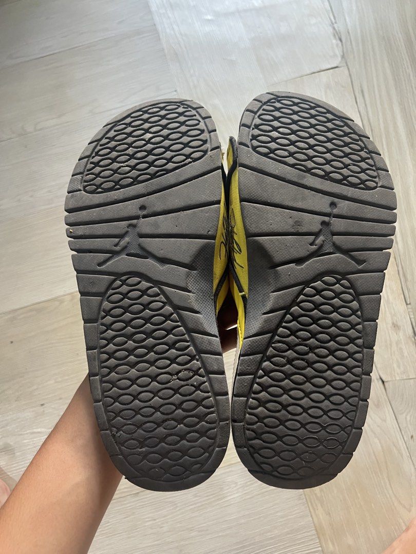 Jordan Slides Yellow Black Men's Size (Category: Slippers & Slides) located in Paranaque City. Submitted by denshit_213 (Listing ID 1443575195, Image 3). Description: - Yellow and black Jordan slides - Adjustable strap for a comfortable fit - Textured sole pattern for enhanced grip - Minor signs of wear on straps and soles - Plenty of life left, perfect for casual wear.