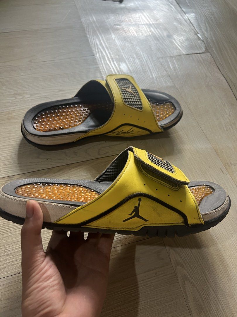 Jordan Slides Yellow Black Men's Size (Category: Slippers & Slides) located in Paranaque City. Submitted by denshit_213 (Listing ID 1443575195, Image 2). Description: - Yellow and black Jordan slides - Adjustable strap for a comfortable fit - Textured sole pattern for enhanced grip - Minor signs of wear on straps and soles - Plenty of life left, perfect for casual wear.