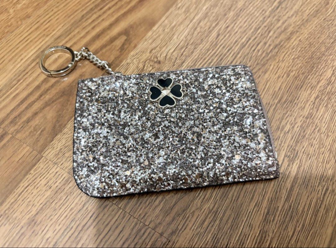 Kate Spade Glitter Card Holder with Keychain (Category: Wallets & Card holders) located in Manila. Submitted by zoemycat (Listing ID 1443683917, Image 1). Description: - Sparkly Kate Spade card holder - Adorable clover detail on the front - Secure zip closure to keep cards safe - Convenient keychain ring included - Multiple card slots on the back for easy organization - Ideal for keeping your essentials tidy.
