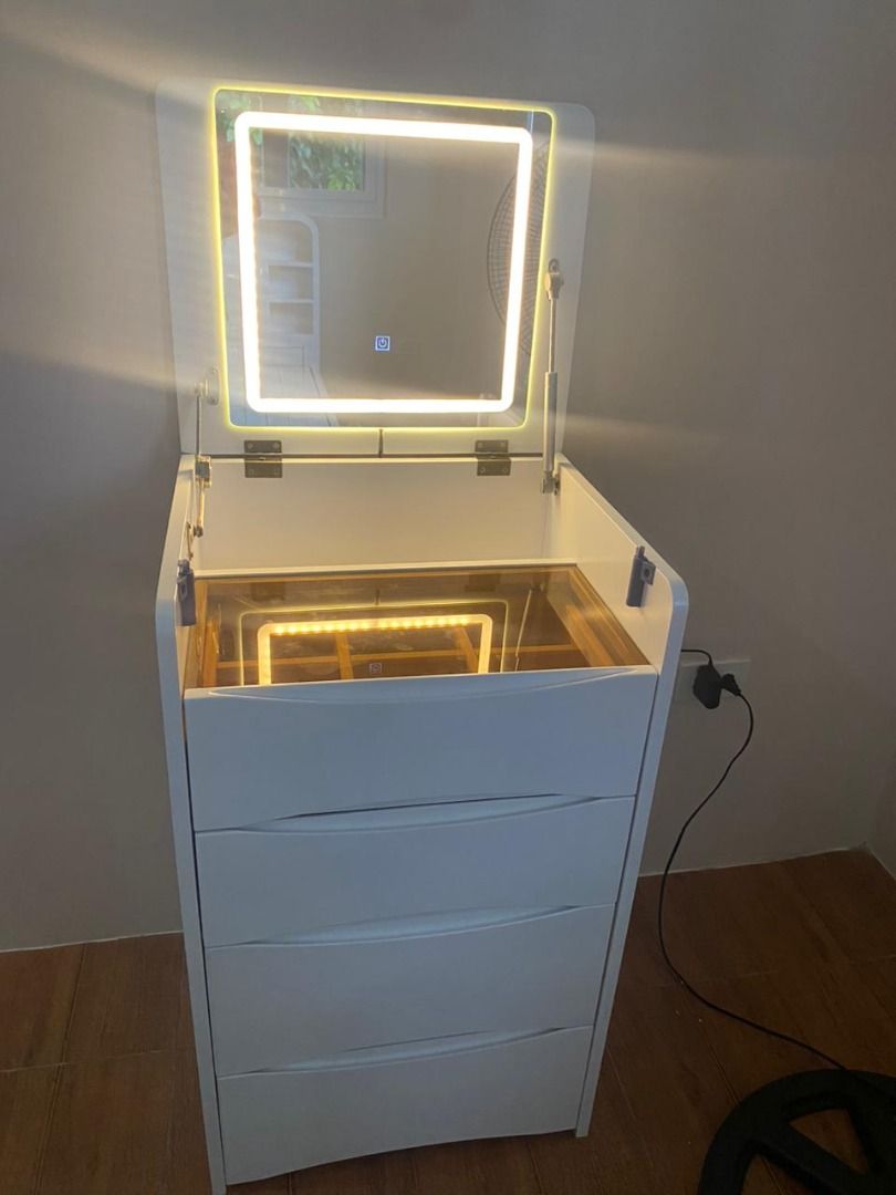 LED Vanity Dresser with Mirror | Makeup Table with Storage (Category: Other Home Furniture) located in Caloocan City. Submitted by lyyyzzzz (Listing ID 1443529836, Image 2). Description: ✔ LED Light Mirror ✔ Hidden Storage Compartments ✔ 3 Large Drawers ✔ Space-Saving Design ✔ Premium Wood Finish 📏 Size: 48cm x 40cm x 82cm 🎨 Colors: Wood, Walnut, White Perfect for organizing makeup, skincare, jewelry, and accessories while adding elegance to yo