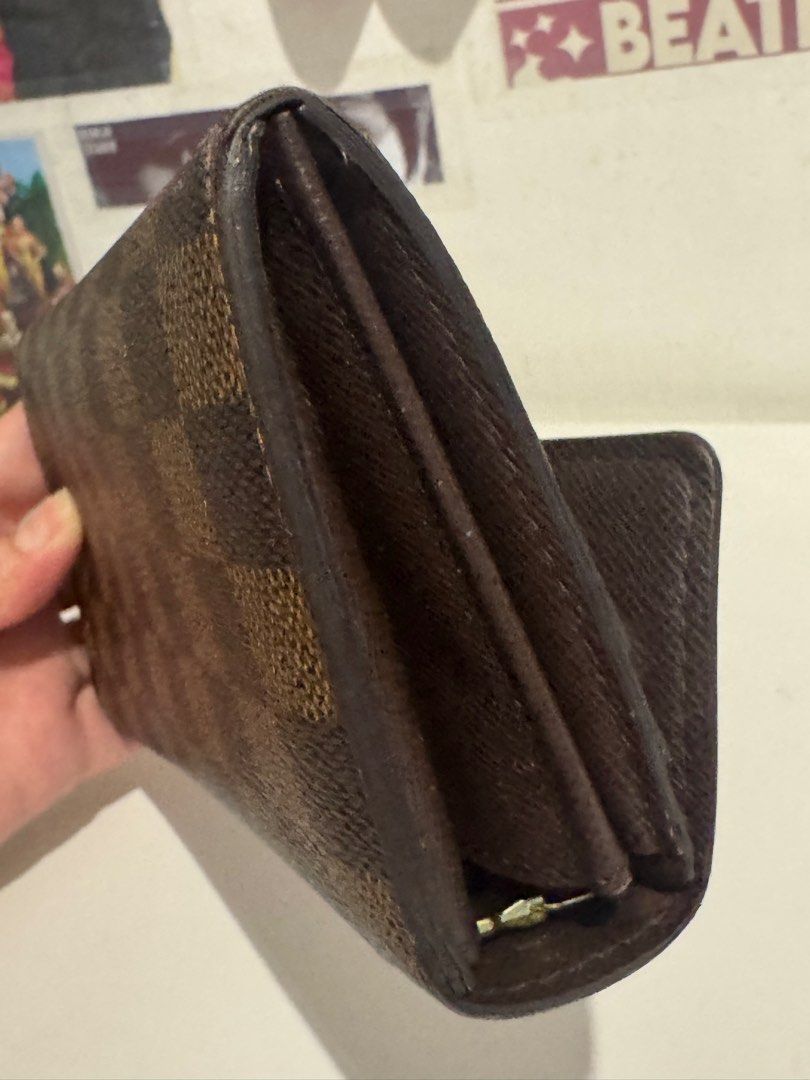 Louis Vuitton Damier Ebene Sarah Wallet (Category: Luxury Bags & Wallets) located in Pasig City. Submitted by acffashion31 (Listing ID 1443692591, Image 3). Description: - Authentic Louis Vuitton Sarah Wallet - Damier Ebene Canvas - Classic checkered pattern - Multiple card slots and compartments - Secure snap button closure - Ideal for everyday use - Flaws: Rubs inner part as seen in the last photo - Money back guaranteed.