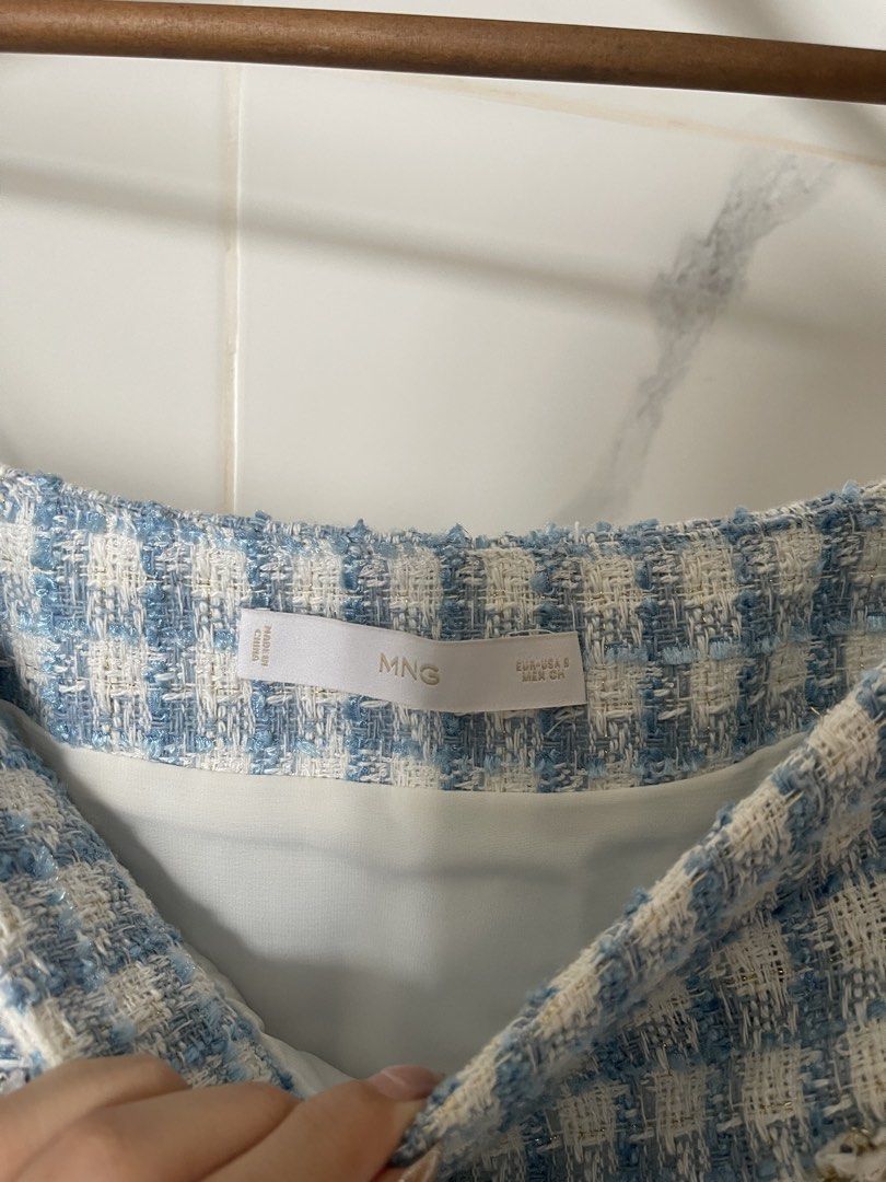 Mango Blue and White Checkered Tweed Skirt - S (Category: Skirts) located in Angeles City. Submitted by svrn_declutter (Listing ID 1443549365, Image 3). Description: Mango Blue Checkered Tweed Skirt - S - worn once/twice - seamlessly zippered by the side - tweed textured fabric - pockets are only for design, slight gold detail on the fabric - Waist: 26 in | Length: 17.5 in (measured manually) - rfs: decluttering - mop: gcash only.
