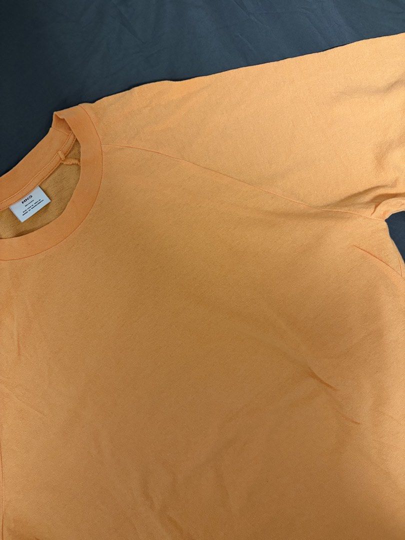 Mango Orange Relaxed Fit T-shirt (Category: Tshirts & Polo Shirts ) located in Pasay City. Submitted by losient (Listing ID 1443664355, Image 3). Description: - Brand: MNG - Color: Orange - Size: Medium (M) - Fit: Relaxed - Origin: Made in Bangladesh - Style: Simple and comfortable, ideal for casual wear.