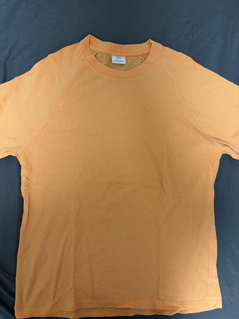 Mango Orange Relaxed Fit T-shirt (Category: Tshirts & Polo Shirts ) located in Pasay City. Submitted by losient (Listing ID 1443664355, Image 1). Description: - Brand: MNG - Color: Orange - Size: Medium (M) - Fit: Relaxed - Origin: Made in Bangladesh - Style: Simple and comfortable, ideal for casual wear.