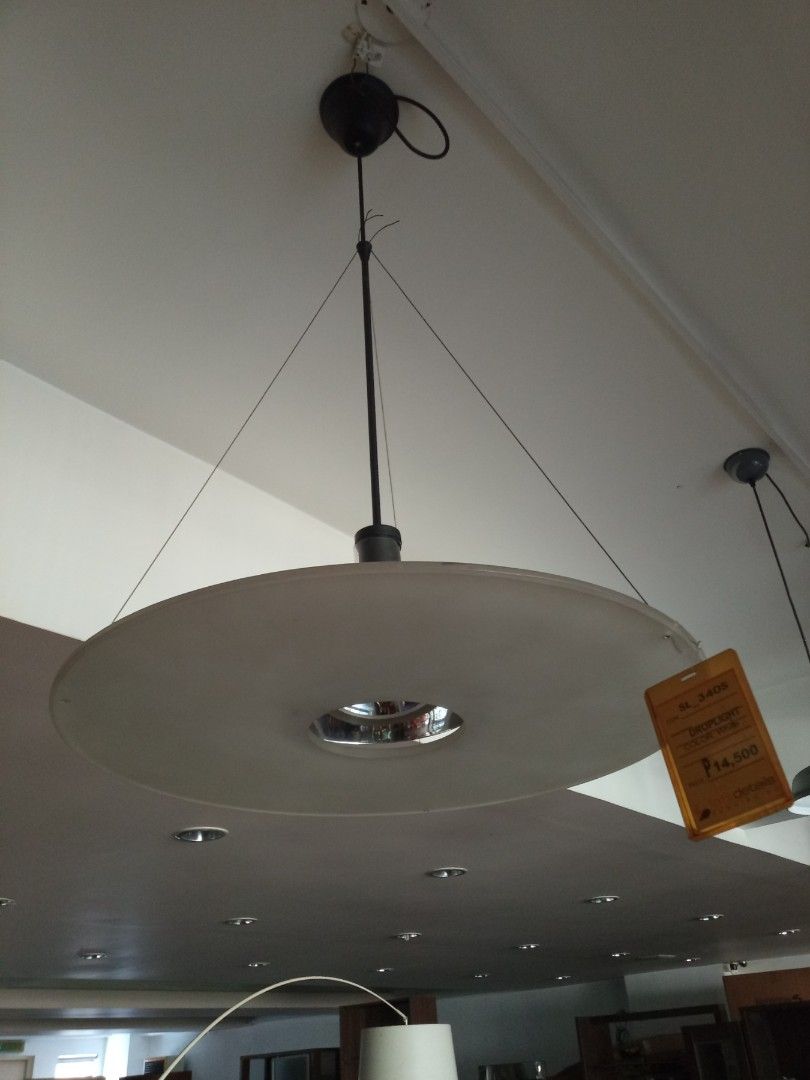 Modern White Disc Pendant Light Fixture (Category: Lighting) located in Pasig City. Submitted by shirls08 (Listing ID 1443517207, Image 2). Description: - Display unit - Modern white disc pendant light - Hangs from the ceiling - Provides a warm, inviting glow - Ideal for living rooms or dining areas - Brand new with price tag still attached - Selling as is.