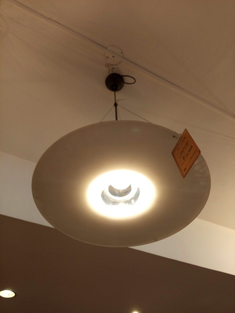 Modern White Disc Pendant Light Fixture (Category: Lighting) located in Pasig City. Submitted by shirls08 (Listing ID 1443517207, Image 1). Description: - Display unit - Modern white disc pendant light - Hangs from the ceiling - Provides a warm, inviting glow - Ideal for living rooms or dining areas - Brand new with price tag still attached - Selling as is.