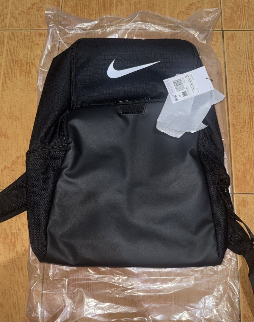 Nike Black Backpack Bag (30L) (Category: Backpacks) located in Navotas City. Submitted by vine_balog (Listing ID 1443569716, Image 1). Description: - Classic black Nike backpack - Iconic Nike swoosh logo - Spacious main compartment - Convenient front zip pocket - Side mesh pockets for water bottles - Comfortable padded shoulder straps - Ideal for school, gym, or everyday use.