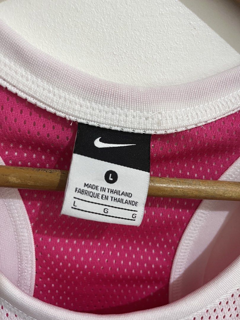 Nike Reversible Tank Top Pink White Size L (Category: Sleeveless) located in Cabanatuan. Submitted by sab_thing (Listing ID 1443579028, Image 3). Description: - Reversible Nike Tank Top - Size: Large (L) pwede din sa Med frame - Side 1: White with pink trim & large white Nike swoosh - Side 2: Bright pink with white trim & small white Nike swoosh - Made in Thailand.