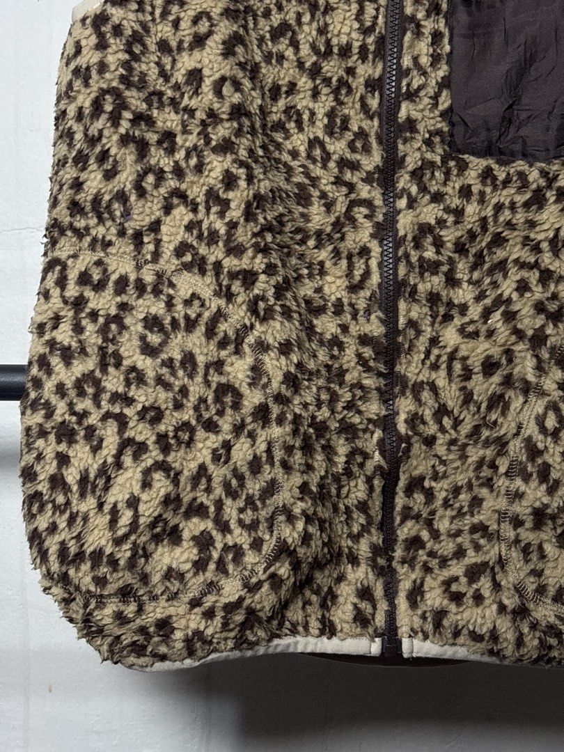 Niko and... Leopard Print Fleece Vest (Category: Vests) located in Manila. Submitted by angelll444 (Listing ID 1443655736, Image 3). Description: - 21x26 Medium - Super cozy leopard print fleece vest from Niko and... - Soft and fluffy material for ultimate comfort. - Features a zip-up front for easy wear. - Includes a chest pocket with a zip closure for secure storage. - Ideal for layering during cooler weather. - Effortlessly style for a casual 