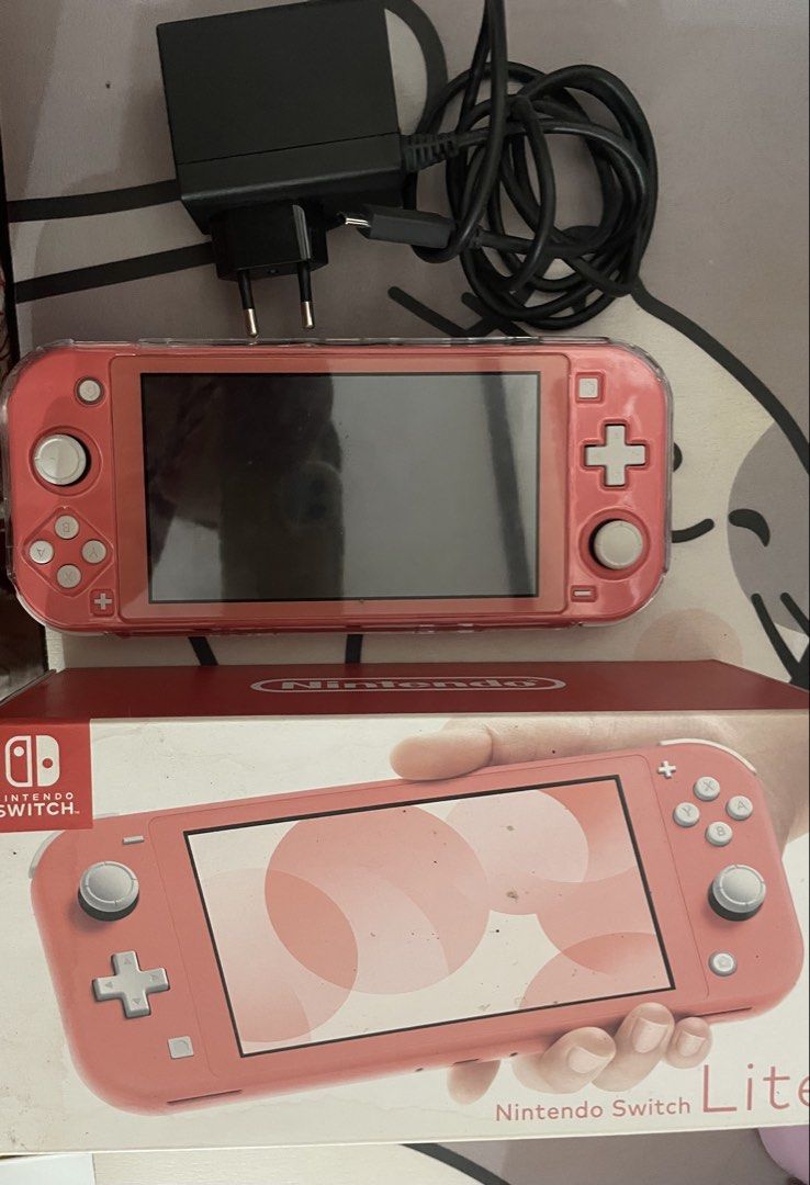 Nintendo Switch Lite Coral with Charger and Box (Category: Nintendo) located in Quezon City. Submitted by shinmnlg (Listing ID 1443674501, Image 1). Description: - Coral Nintendo Switch Lite - Original charger included - Original box included -case and tempered glass installed - bag - no games included -purchased last NOV 2024.