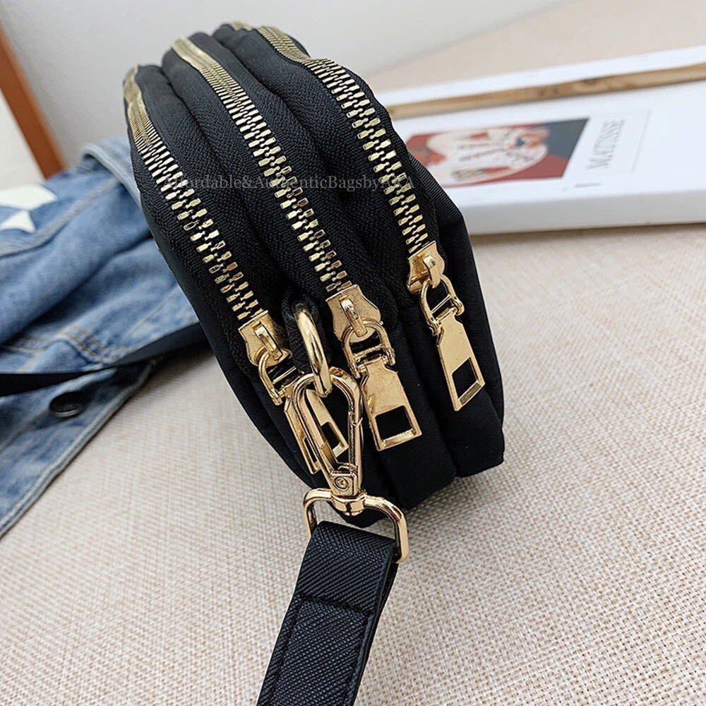 NYLON PR A DA VIP BEAUTE CROSSBODY BAG (Category: Luxury Bags & Wallets) located in Daet. Submitted by ecassenluxuries (Listing ID 1443556557, Image 3). Description: 📌 FIXED PRICE ALREADY ▫️ Stylish black nylon crossbody bag ▫️ Three convenient zippered compartments ▫️ Elegant gold hardware details ▫️ Adjustable modified strap for a custom fit ▫️ Ideal for carrying essentials like your phone, wallet, and makeup ▫️Easy access to all your items ✅ 