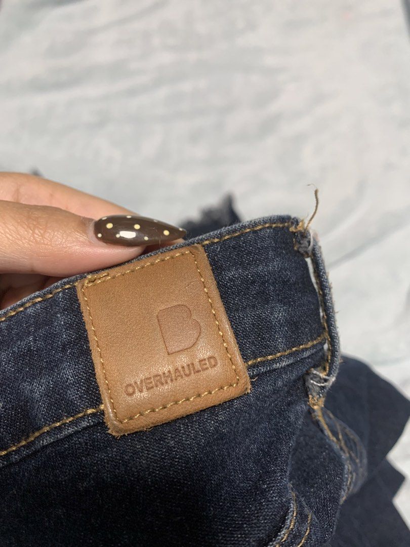 Overhauled Dark Wash Denim Jeans (Category: Jeans) located in Manila. Submitted by yenna88 (Listing ID 1443671131, Image 2). Description: - Style: Dark wash denim jeans - Feature: Raw hem detail - Condition: Light marks on leg (please check photos) - Occasion: Perfect for casual wear - not sure about size.