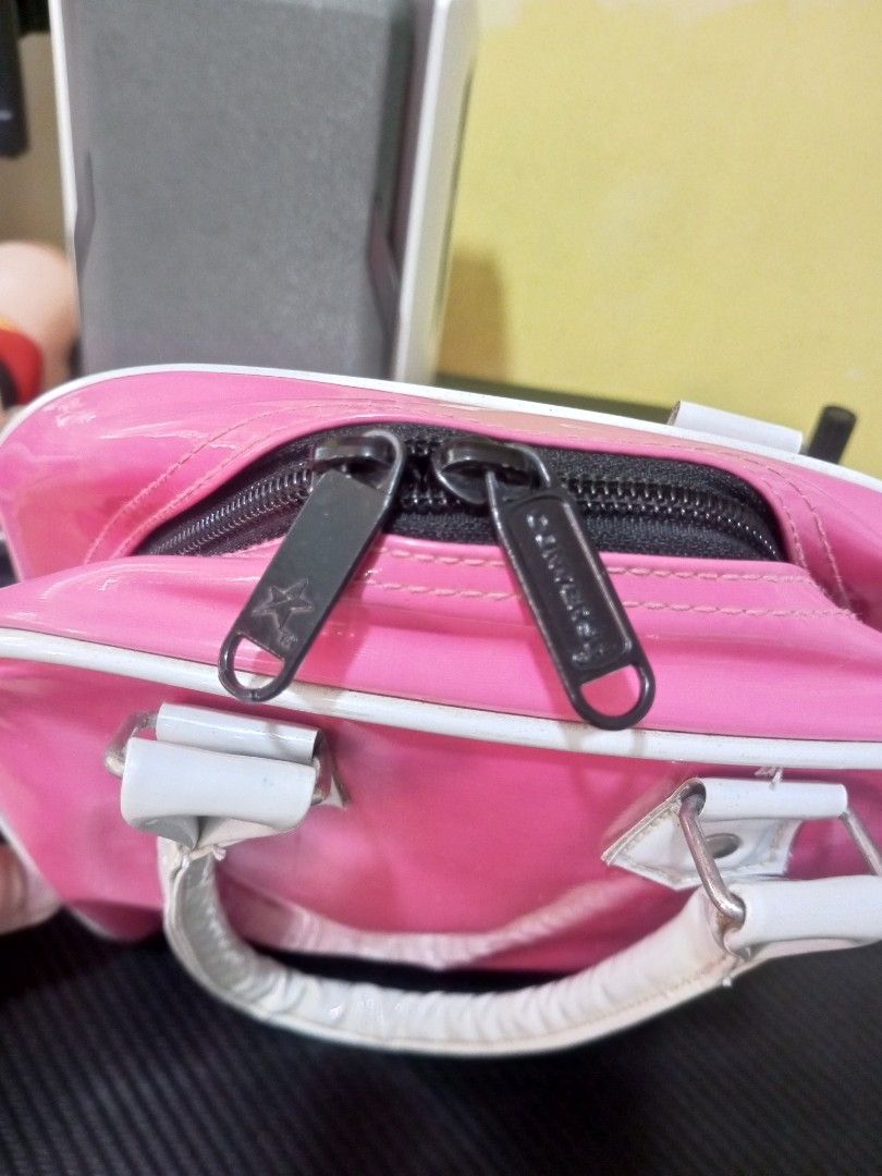Pink Converse Mini Boston Bag (Category: Tote Bags) located in Malabon City. Submitted by blackscent (Listing ID 1443574796, Image 2). Description: - Adorable pink Converse mini Boston bag - Shiny patent material with crisp white trim and handles As is. Check photos for condition. Shipping fee will be shlouldered by buyer. Meetups in Malabon areas only.