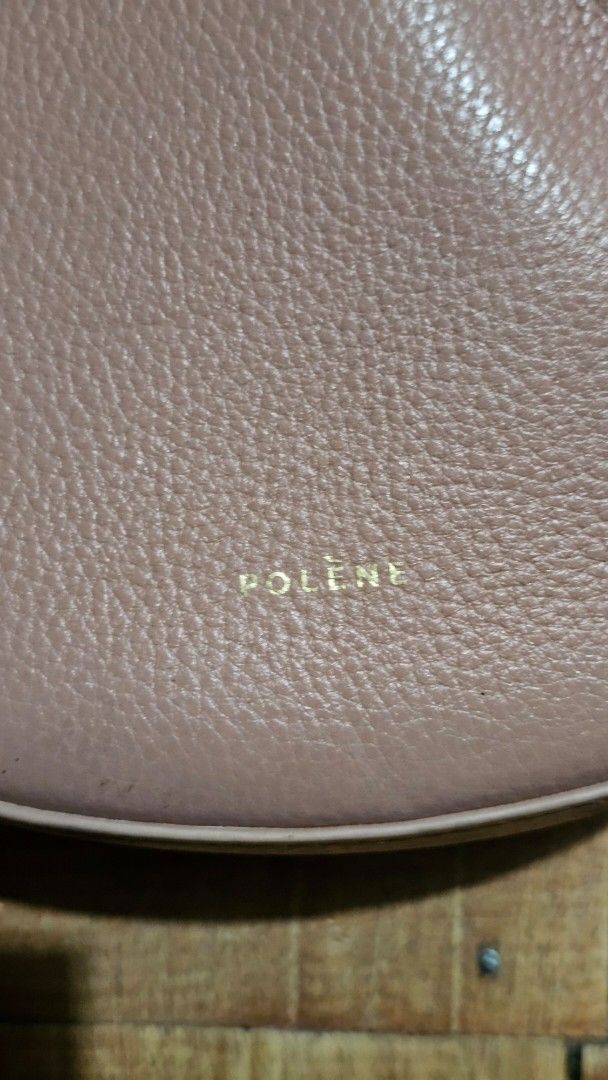 Polène Numéro Un Nano Bag in Taupe (Category: Luxury Bags & Wallets) located in Kibawe. Submitted by Thrift_ni_Babac (Listing ID 1443613275, Image 3). Description: - Polène Numéro Un Nano Bag - Color: Taupe/Dusty Rose - Material: Textured Leather - Hardware: Gold - Strap: Adjustable - Condition: Good - Perfect for everyday or evening wear.