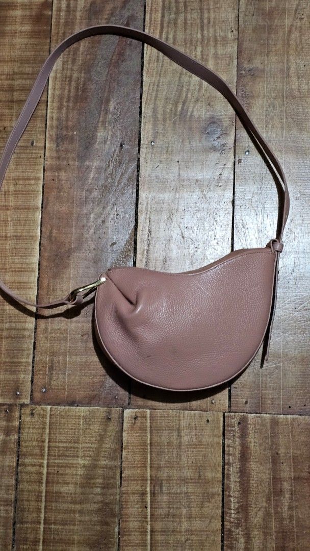 Polène Numéro Un Nano Bag in Taupe (Category: Luxury Bags & Wallets) located in Kibawe. Submitted by Thrift_ni_Babac (Listing ID 1443613275, Image 2). Description: - Polène Numéro Un Nano Bag - Color: Taupe/Dusty Rose - Material: Textured Leather - Hardware: Gold - Strap: Adjustable - Condition: Good - Perfect for everyday or evening wear.
