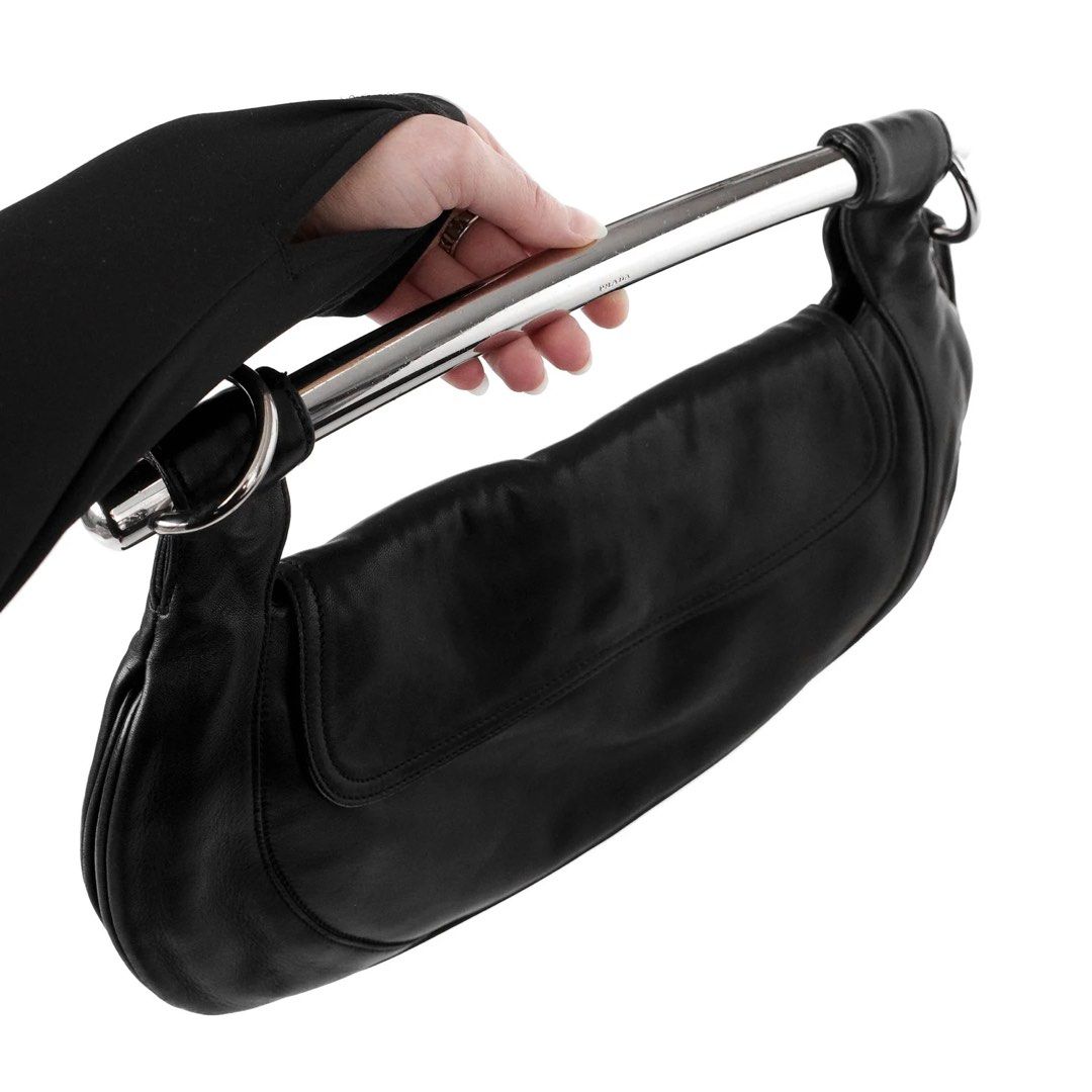 Prada Black Leather Swing Bag SS2003 with Silver Handle (Category: Luxury Bags & Wallets) located in Cebu City. Submitted by fashunkillaa (Listing ID 1443666123, Image 3). Description: Waiting for my package to arrive. Putting it on sale here before I change my mind lol. This is a really classic one. I hope I don’t regret selling this. - Authentic Prada black leather shoulder bag - Features a sleek silver metal handle - Made from soft, draping le