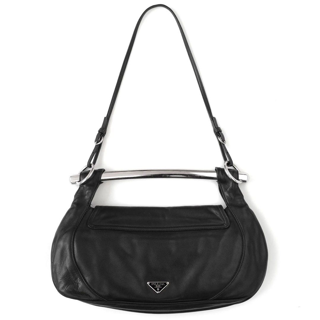 Prada Black Leather Swing Bag SS2003 with Silver Handle (Category: Luxury Bags & Wallets) located in Cebu City. Submitted by fashunkillaa (Listing ID 1443666123, Image 1). Description: Waiting for my package to arrive. Putting it on sale here before I change my mind lol. This is a really classic one. I hope I don’t regret selling this. - Authentic Prada black leather shoulder bag - Features a sleek silver metal handle - Made from soft, draping le