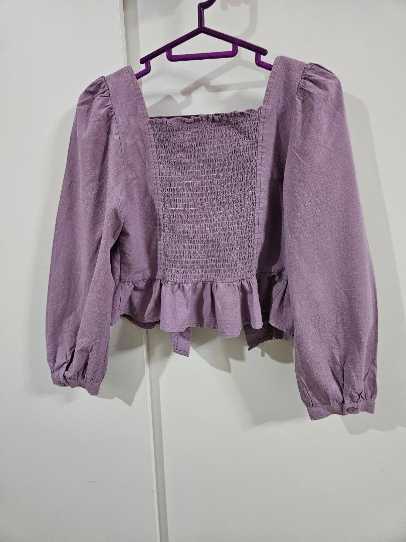 Purple Smocked Puff Sleeve Crop Top (Category: Babies & Kids Fashion) located in Caloocan City. Submitted by rm.diaz (Listing ID 1443604656, Image 2). Description: - Adorable purple crop top - Comfortable smocked bodice - Stylish puff sleeves with elastic cuffs - Functional button details down the front - Delicate ruffle trim along the smocking - Perfect for casual or dressed-up looks.