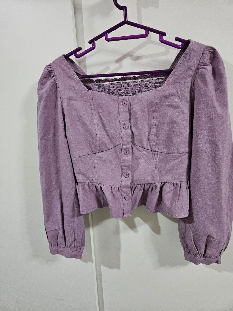 Purple Smocked Puff Sleeve Crop Top (Category: Babies & Kids Fashion) located in Caloocan City. Submitted by rm.diaz (Listing ID 1443604656, Image 1). Description: - Adorable purple crop top - Comfortable smocked bodice - Stylish puff sleeves with elastic cuffs - Functional button details down the front - Delicate ruffle trim along the smocking - Perfect for casual or dressed-up looks.