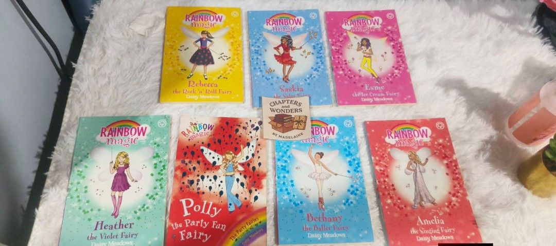 Rainbow Magic Books - Fairy Collection (Category: Children's Books) located in Cabuyao City. Submitted by chaptersandwonders143 (Listing ID 1443593327, Image 1). Description: - Set of Rainbow Magic books by Daisy Meadows (7books). - Features fairy stories with characters like Princess, Sadie, Lily, Heather, Polly, Bethany, and Amelia. - Ideal for young readers who enjoy fantasy and fairy tales. - A fun and engaging collection to add to any child'