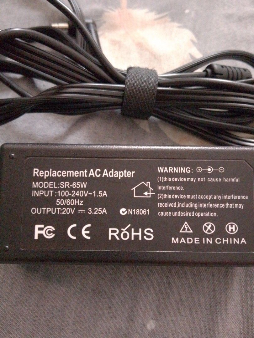 Replacement AC Adapter SR-65W 20V 3.25A (Category: Chargers) located in Manila. Submitted by itsurpaul. (Listing ID 1443509618, Image 1). Description: - Replacement AC adapter for laptops - Model: SR-65W - Universal Voltage Input: 100-240V~1.5A 50/60Hz - Output: 20V 3.25A - Connector Type: Right-angle plug - Origin: Made in China.
