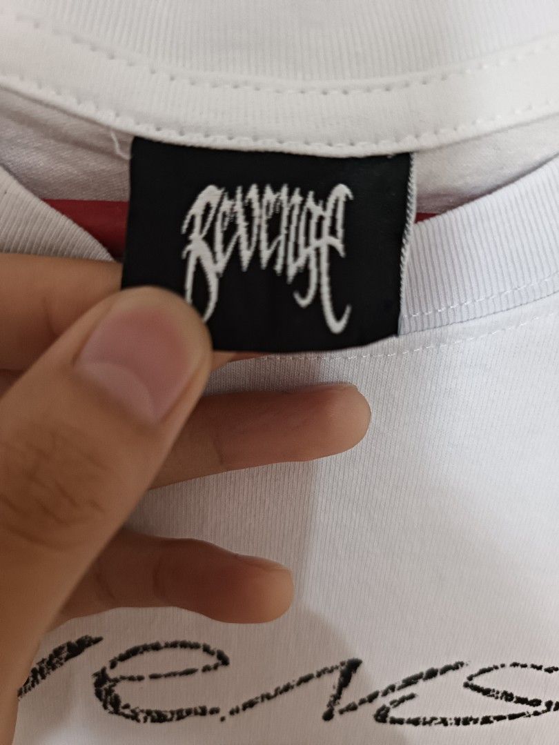 Revenge "Heavent Sent" Graphic Tee (Category: Tshirts & Polo Shirts ) located in Quezon City. Submitted by david.majarucon (Listing ID 1443625658, Image 2). Description: an authentic Revenge "Heaven Sent" Tee in parchment (White), size Medium. Features the brand's signature dark streetwear aesthetic with a detailed, sketch-style black graphic of a nun and a priest. Printed on premium, heavyweight cotton for a perfect modern fit. 21 x 28.