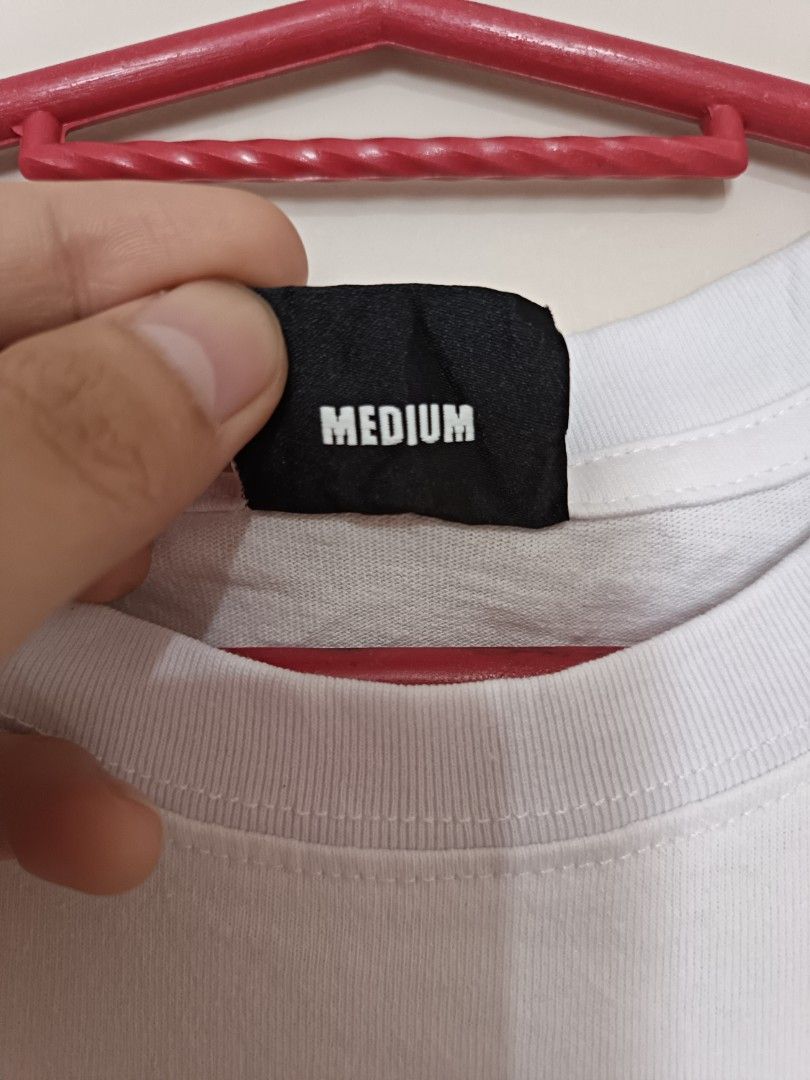 Revenge "Heavent Sent" Graphic Tee (Category: Tshirts & Polo Shirts ) located in Quezon City. Submitted by david.majarucon (Listing ID 1443625658, Image 3). Description: an authentic Revenge "Heaven Sent" Tee in parchment (White), size Medium. Features the brand's signature dark streetwear aesthetic with a detailed, sketch-style black graphic of a nun and a priest. Printed on premium, heavyweight cotton for a perfect modern fit. 21 x 28.