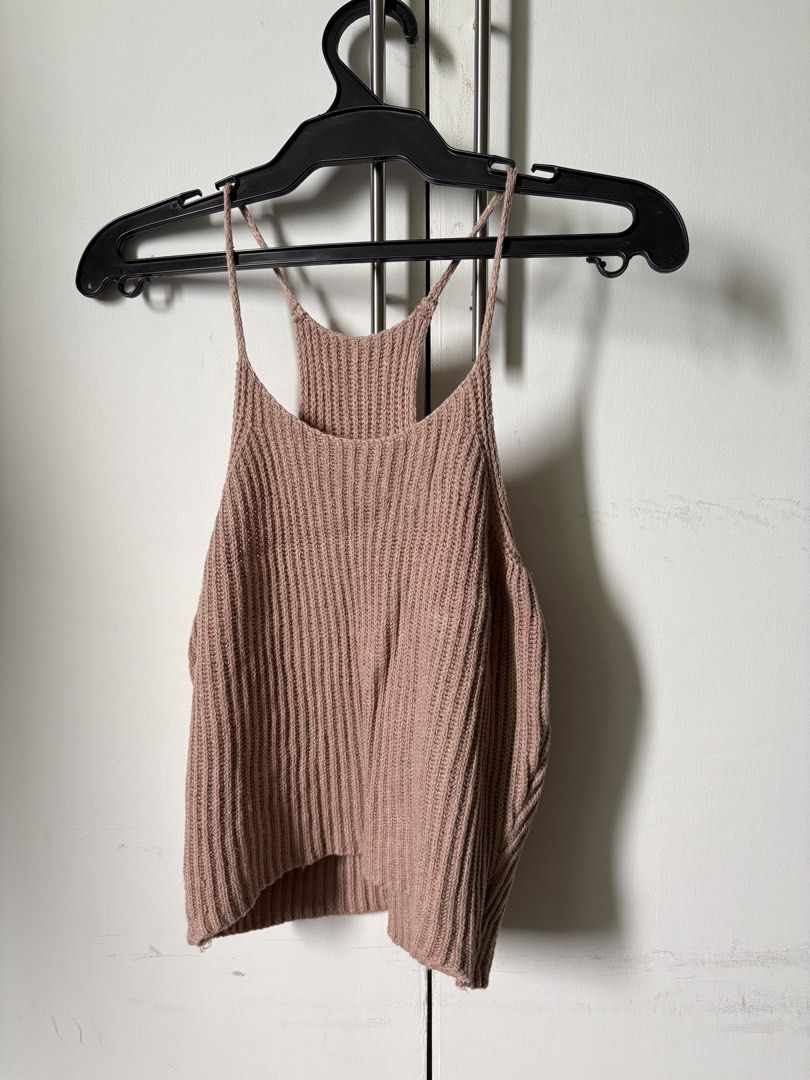 Ribbed Knit Spaghetti Strap Tank Top (Category: Sleeveless) located in Pasig City. Submitted by declutter_dpc (Listing ID 1443589700, Image 1). Description: - Cute ribbed knit tank top - Features thin spaghetti straps and a racerback design - Made from soft and stretchy material - Perfect for layering or wearing on its own - Easily pairs with jeans, skirts, and other bottoms - A versatile addition to any wardrobe.