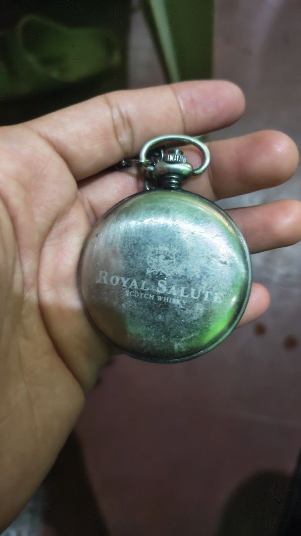 Royal Salute Pocket Watch with Chain (Category: Luxury Watches) located in Manila. Submitted by don.suriuq20 (Listing ID 1443569657, Image 3). Description: - Vintage-style pocket watch - Features a lion emblem on the front cover - Back engraved with 'Royal Salute Scotch Whisky' - Comes with a metal chain - Ideal for collectors or as a unique accessory.