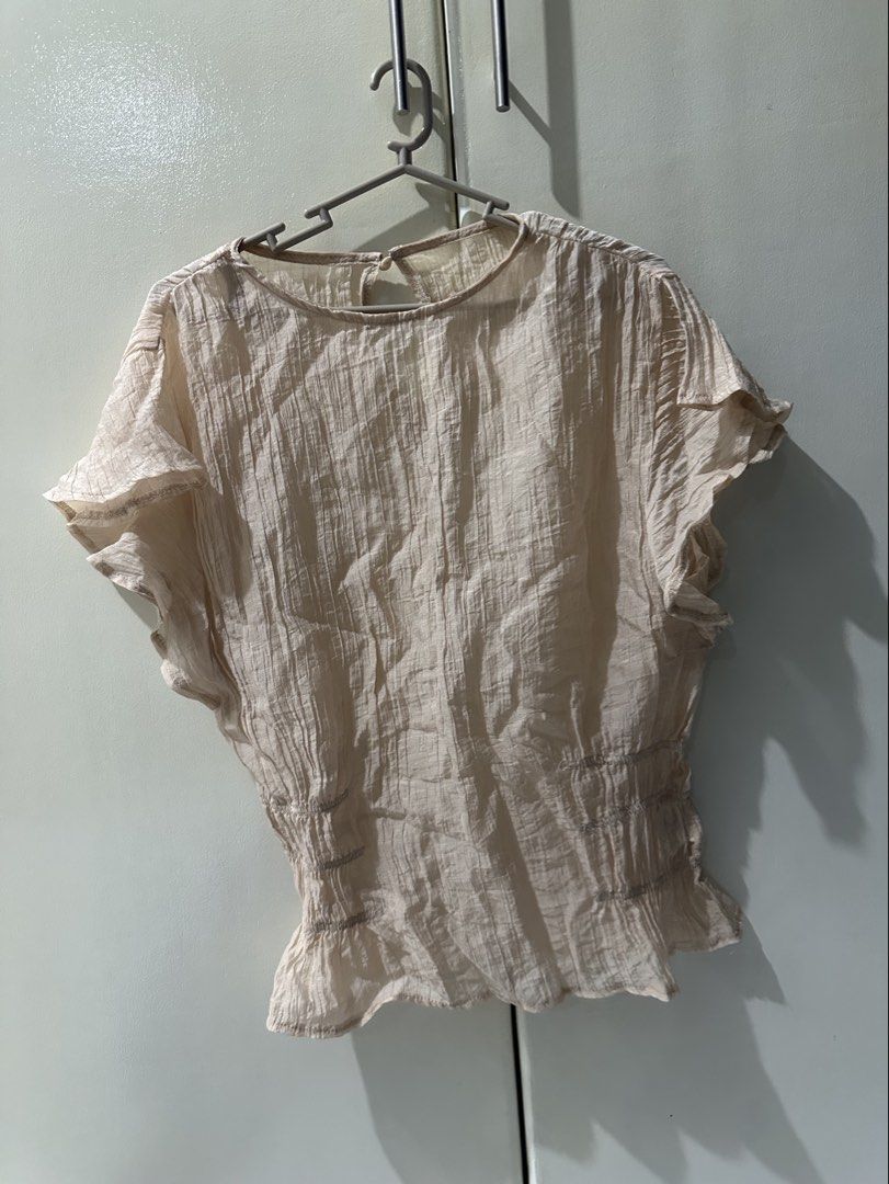 Sheer Textured Peplum Top with Ruffle Sleeves (Category: Blouses) located in Manila. Submitted by loved_ag (Listing ID 1443528573, Image 3). Description: - Lightweight sheer top - Textured crinkle fabric - Flattering ruched waist - Delicate ruffle sleeves - Keyhole closure at the back - Perfect with jeans or skirts - Easy to dress up or down.