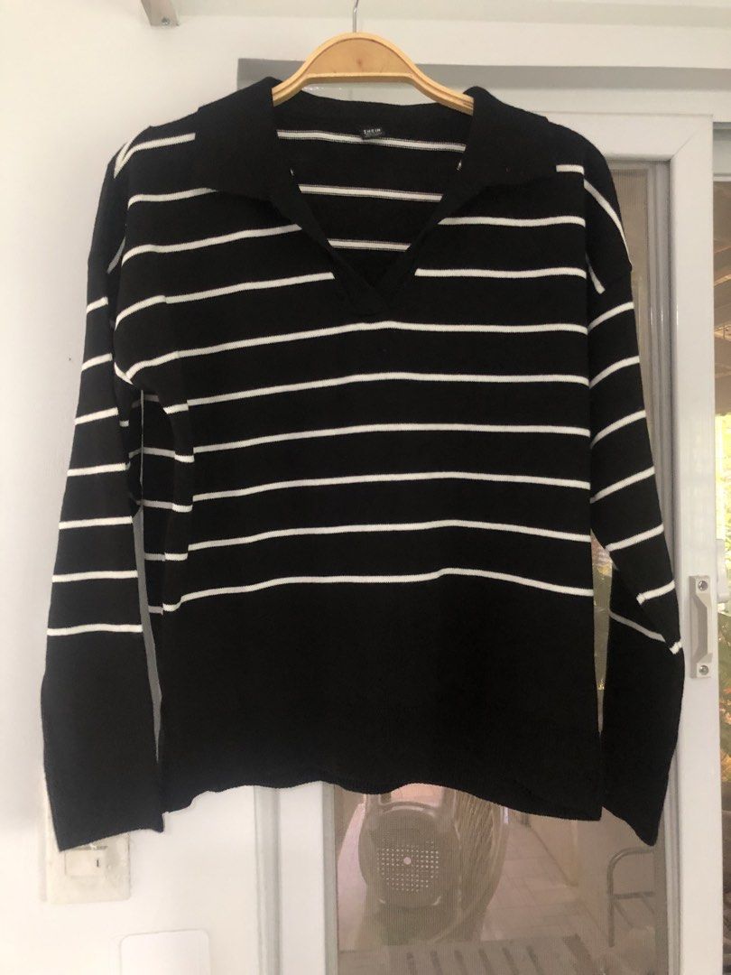 SHEIN Black and White Striped Collared Sweater - One Size (Category: Longsleeves) located in Manila. Submitted by rshay (Listing ID 1443519237, Image 1). Description: - Black and white striped sweater - Brand: SHEIN - Size: One Size Fits All - Features: Collared neckline with V-cut, Long sleeves - Origin: Made in Turkey - Styling: Easy to pair with jeans or skirts.