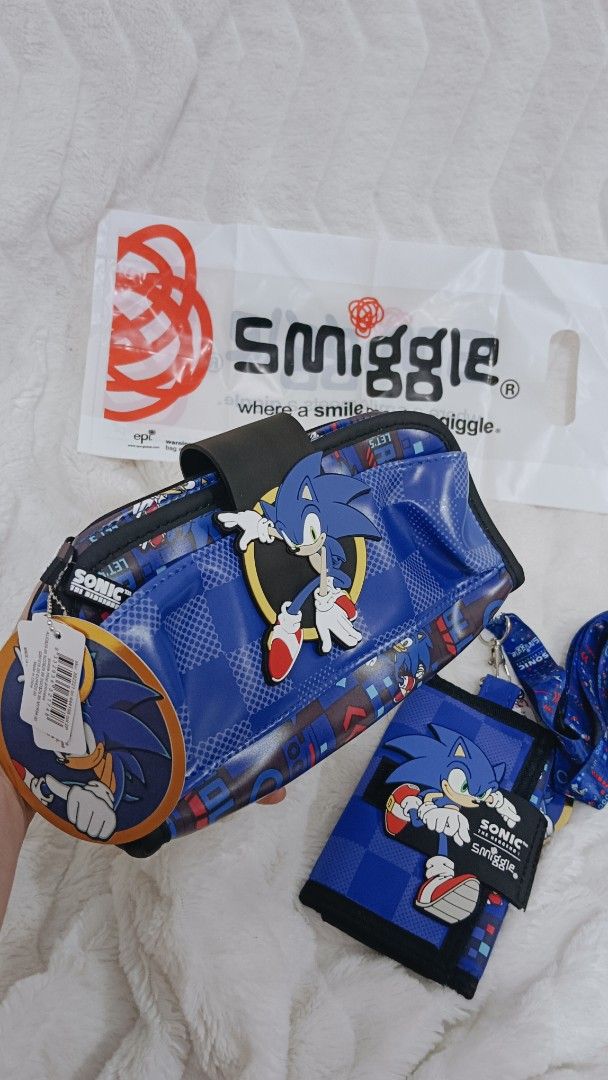 Smiggle Sonic The Hedgehog Pencil Case & Wallet Set (Category: Stationery & School Supplies) located in Manila. Submitted by masterlei (Listing ID 1443640176, Image 1). Description: - Super cool Smiggle pencil case and wallet set - Features awesome Sonic the Hedgehog design - Pencil case opens to reveal multiple compartments and elastic pen loops - Wallet has a checkered pattern with Sonic - Comes with original Smiggle bag - Perfect gift for any 