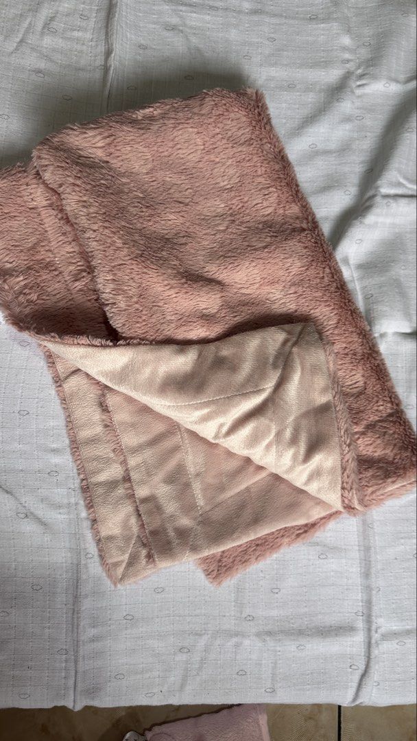 Soft Pink Fluffy Baby Blanket (Category: Babies & Kids Fashion) located in Quezon City. Submitted by declutteringmj (Listing ID 1443561481, Image 2). Description: - Super soft and fluffy pink blanket - Ideal for cozying up on the couch or adding warmth to your bed - Reversible design: one side fluffy, the other a smooth satin-like material - Perfect for chilly evenings Location: Quezon City .