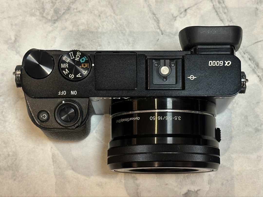 Sony a6000 with Kit Lens (Category: Cameras) located in Quezon City. Submitted by penguinco (Listing ID 1443561728, Image 2). Description: 📸 Sony a6000 Mirrorless Camera (ILCE-6000L) - bought in 2019 at Sony SM North - 11,800 shutter count (low usage) - comes with original box, manuals - body + 16-50mm Power Zoom Lens - eyepiece cap - lens cap - micro usb cable + power cord (charger) - rechargeable battery - shoulder strap 👉 Free Extras (see la
