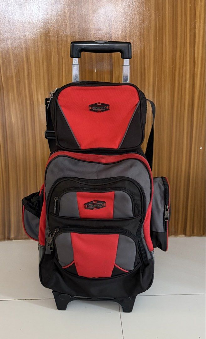Sparky Trolley Bag (Category: Strollers) located in Caloocan City. Submitted by j.affordafindsph (Listing ID 1443668726, Image 1). Description: Authentic Puffy and Sparky Large Upright Stroller. Red and grey colorway. Has a retractable handle and wheels for easy transport. Multiple compartments and pockets for organization. Great for school or travel. Durable material. Detachable zippered side pocket on the other side Identification label at the 