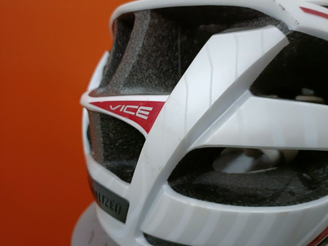 Specialized White Cycling Helmet (Category: Parts & Accessories) located in Singapore. Submitted by edot77 (Listing ID 1443647995, Image 3). Description: - Specialized cycling helmet - White with red accents - Good ventilation with multiple vents - Adjustable straps for a secure fit - No inner liner/head padding .