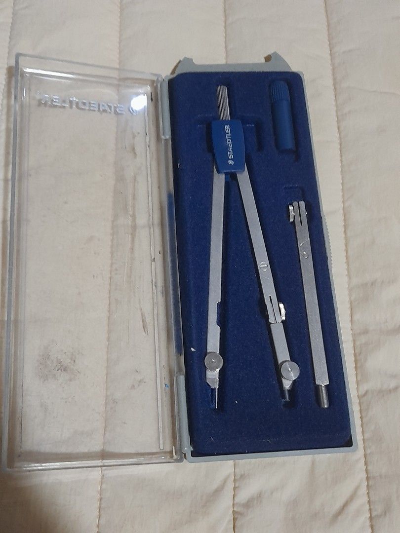 Staedtler Compass Set with Case (Category: Stationery & School Supplies) located in Quezon City. Submitted by alexayizhou (Listing ID 1443539638, Image 2). Description: Staedtler compass set, includes main compass, extension bar, and pencil holder in original case Shipping: Lalamove or GrabExpress (shipping to be shouldered by buyer) MOP: Gcash to be sent before pick up or during meet up (cash allowed) No returns! WYSIWYG.