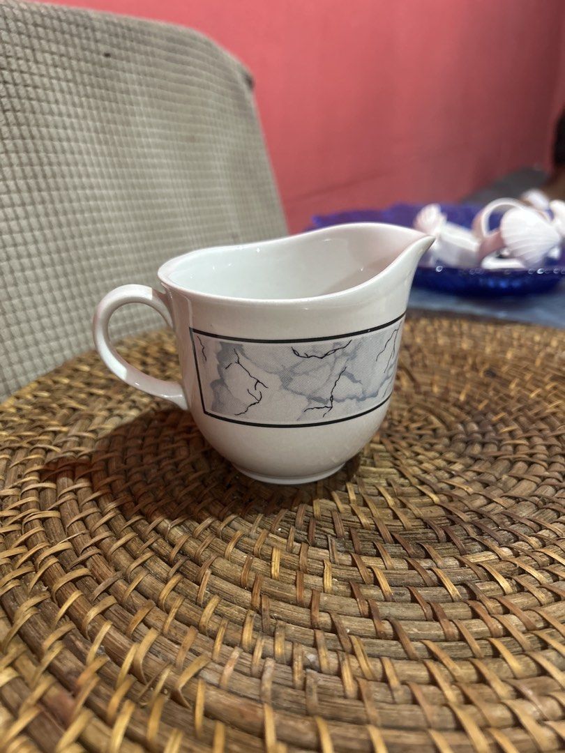 Staffordshire Tableware Creamer Jug - Marble Pattern (Category: Coffee & Tea Tableware) located in Bacolod City. Submitted by azedc (Listing ID 1443629373, Image 1). Description: - White ceramic creamer jug - Black and grey marble-effect band - Features a handle and pouring spout - Made by Staffordshire Tableware, England - Ideal for serving cream or sauces - Clean interior, ready for use.