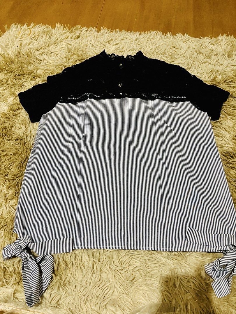 Striped Lace Top with Tie Details (Category: Sleeveless) located in Pasig City. Submitted by samotsari (Listing ID 1443649100, Image 3). Description: - Black lace top with a pinstripe body - Short sleeves - Cute tie details on the sides - High neckline with lace trim - Perfect for dressing up or down.