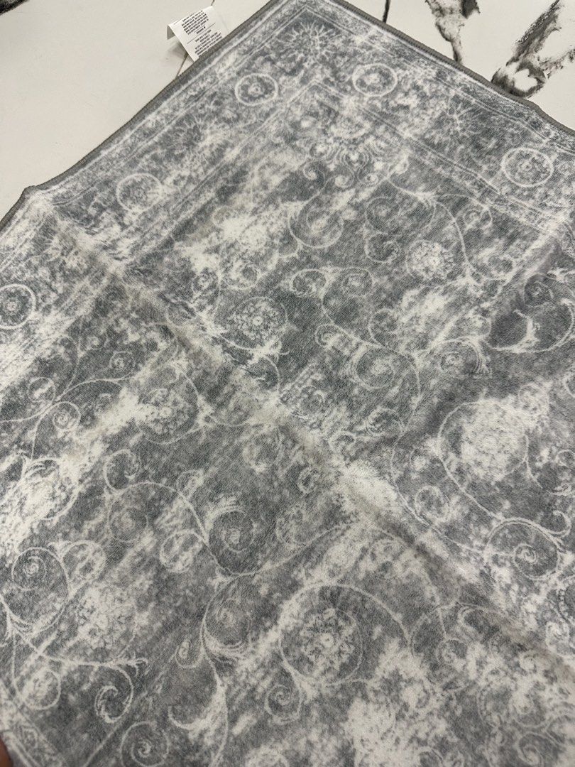 SunNewt Grey Oriental Pattern Rug “Runner” (Category: Carpets, Mats & Flooring) located in Caloocan City. Submitted by janine2006 (Listing ID 1443571889, Image 3). Description: - Stylish grey rug with an oriental-inspired design. - Features a soft surface for comfort. - High-density felt backing for durability. - Initial slight odor and creases are normal; recommend airing out and laying flat for a few days. - Place on a clean, dry floor and ensu