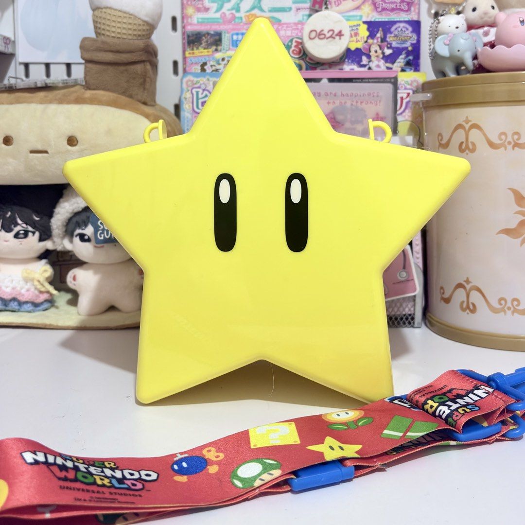 Super Nintendo World Star Popcorn bucket (Category: Character Goods) located in Quezon City. Submitted by ddanabin (Listing ID 1443557051, Image 1). Description: - Authentic Yellow Star Popcorn bucket from Super Nintendo World. - Includes a red strap - Clean Condition - Light is working (battery operated) can and willing to send more photos .