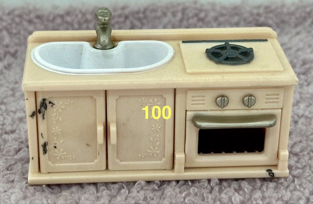 Sylvanian Kitchen Sink Stove Oven Set (Category: Bathroom & Kitchen Fixtures) located in Quezon City. Submitted by flying_mom (Listing ID 1443576892, Image 1). Description: - Miniature kitchen set for dollhouses - Includes sink, faucet, stove, and oven - Light beige color with charming floral details on cabinet doors - Note: Some minor marks present on the cabinet doors - Ideal for dollhouse play or creating dioramas .