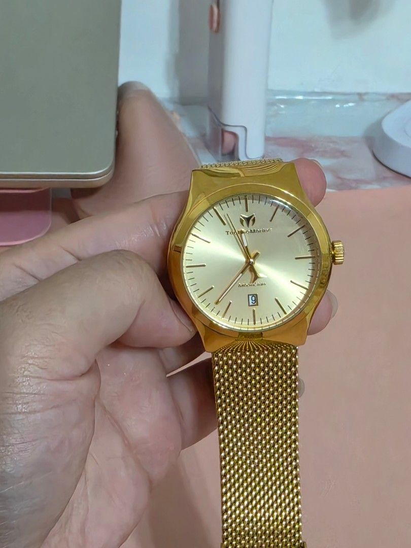 TechnoMarine Gold Watch with Mesh Strap (Category: Women's Watches) located in Muntinlupa City. Submitted by closetfindsbyanne (Listing ID 1443515459, Image 3). Description: - Genuine TechnoMarine Gold Watch - Comes with original box - Features an adjustable mesh strap for a comfortable fit - Classic design with a convenient date display - Versatile for both everyday wear and special events.