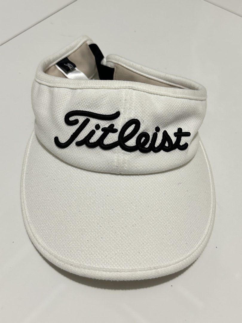 Titleist White Golf Visor (Category: Caps & Hats) located in Manila. Submitted by loved_ag (Listing ID 1443619420, Image 1). Description: - White Titleist golf visor - Adjustable strap for a secure fit - Comfortable inner lining - Ideal for sunny days on the golf course - Helps keep sun out of your eyes during play.
